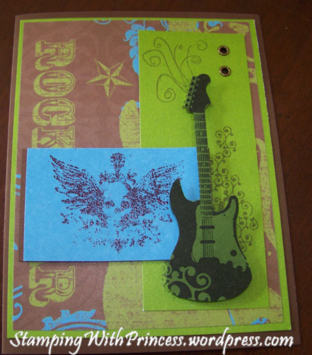 homemade skull card with guitar in greens blues and browns